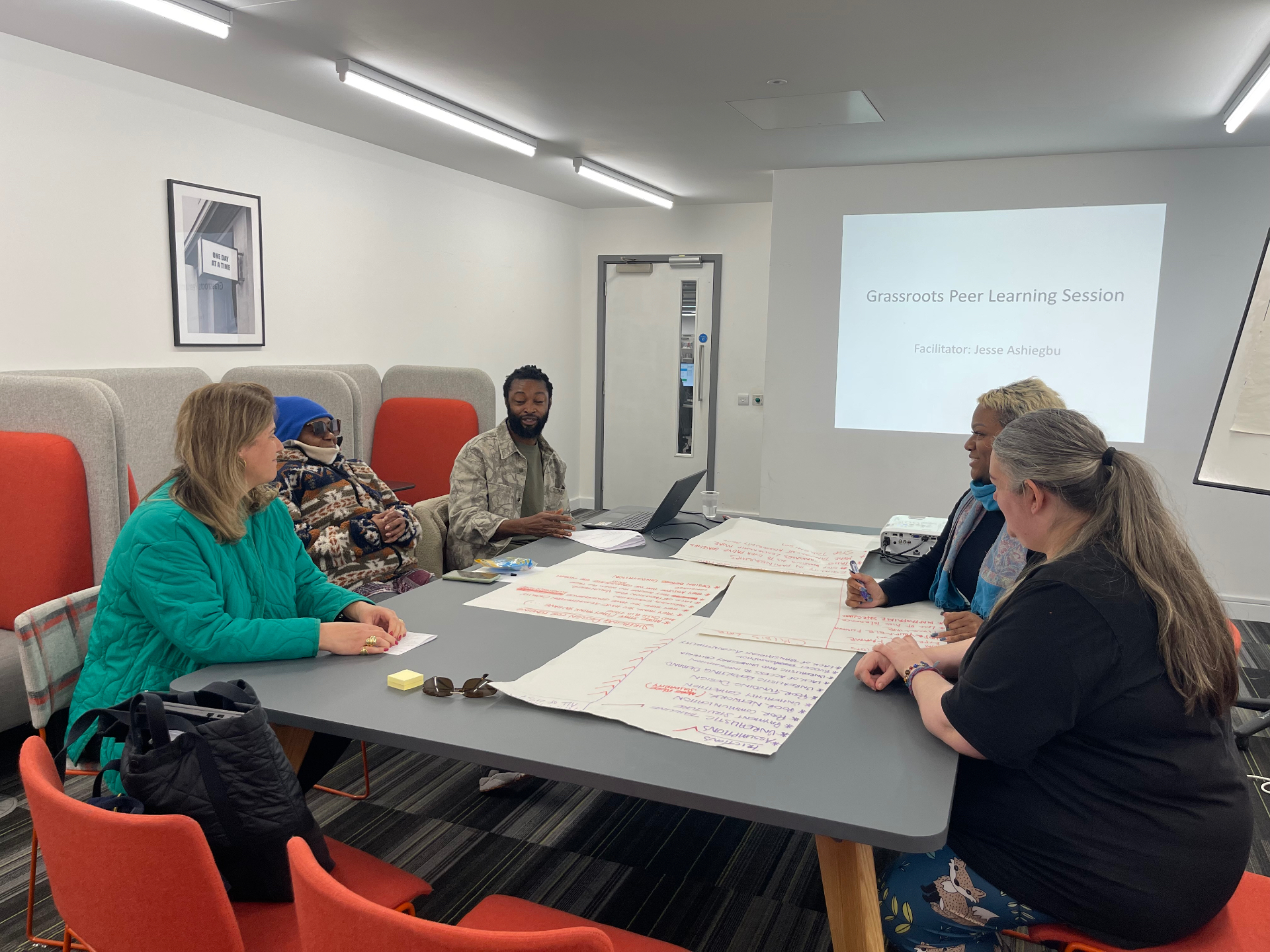 Partners gathered around a table in shared discussion
